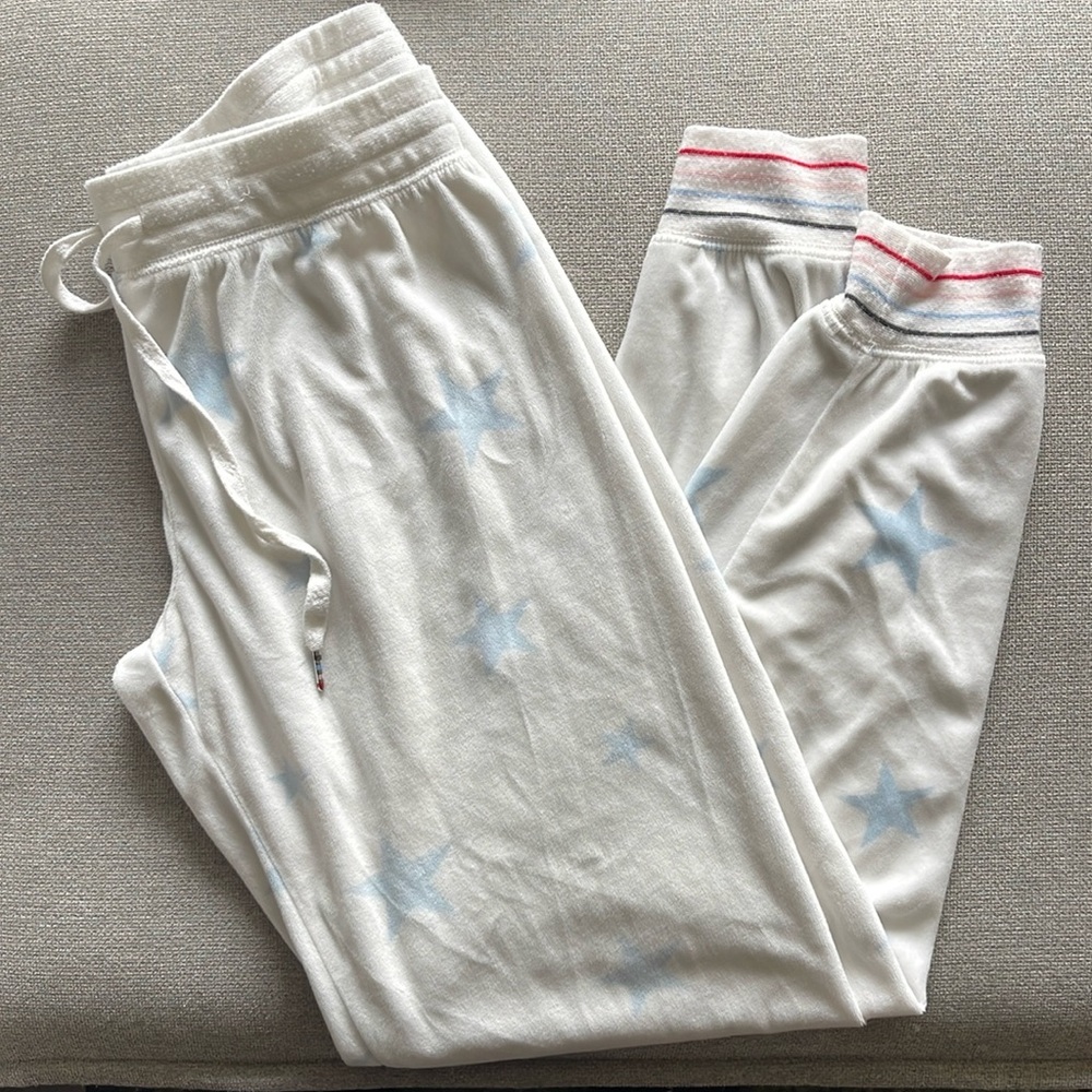 PJ Salvage white velour drawstring pajama pants with blue stars.